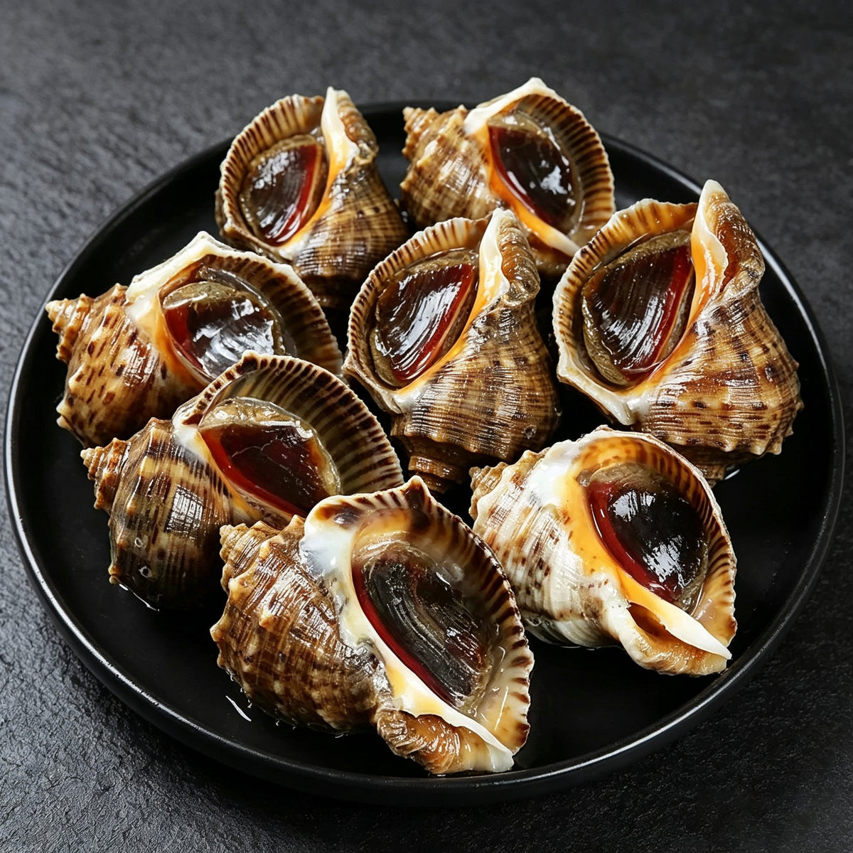Sea whelks plated on ice, ready to serve